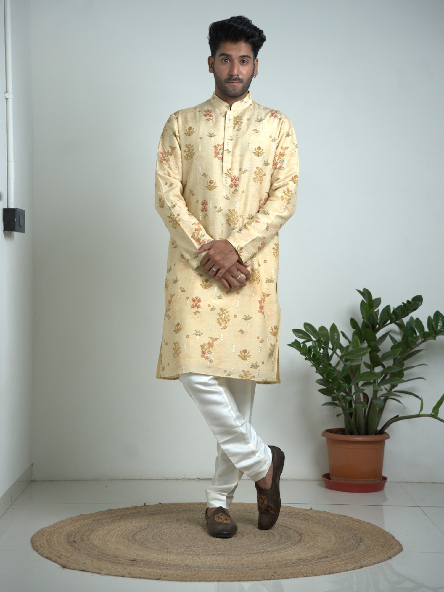Cream Tusser silk with mirror work kurta trouser set.