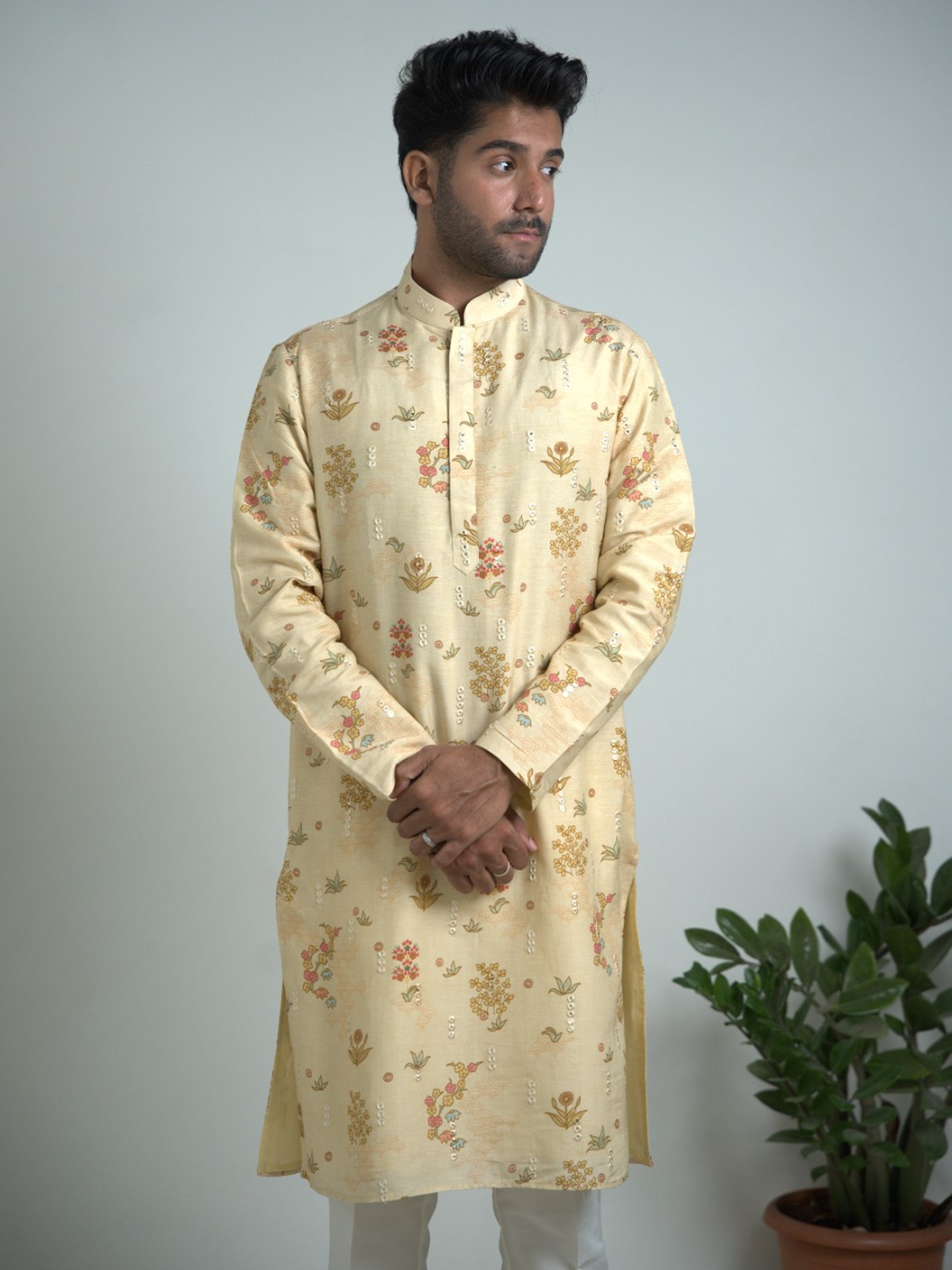 Cream Tusser silk with mirror work kurta trouser set.