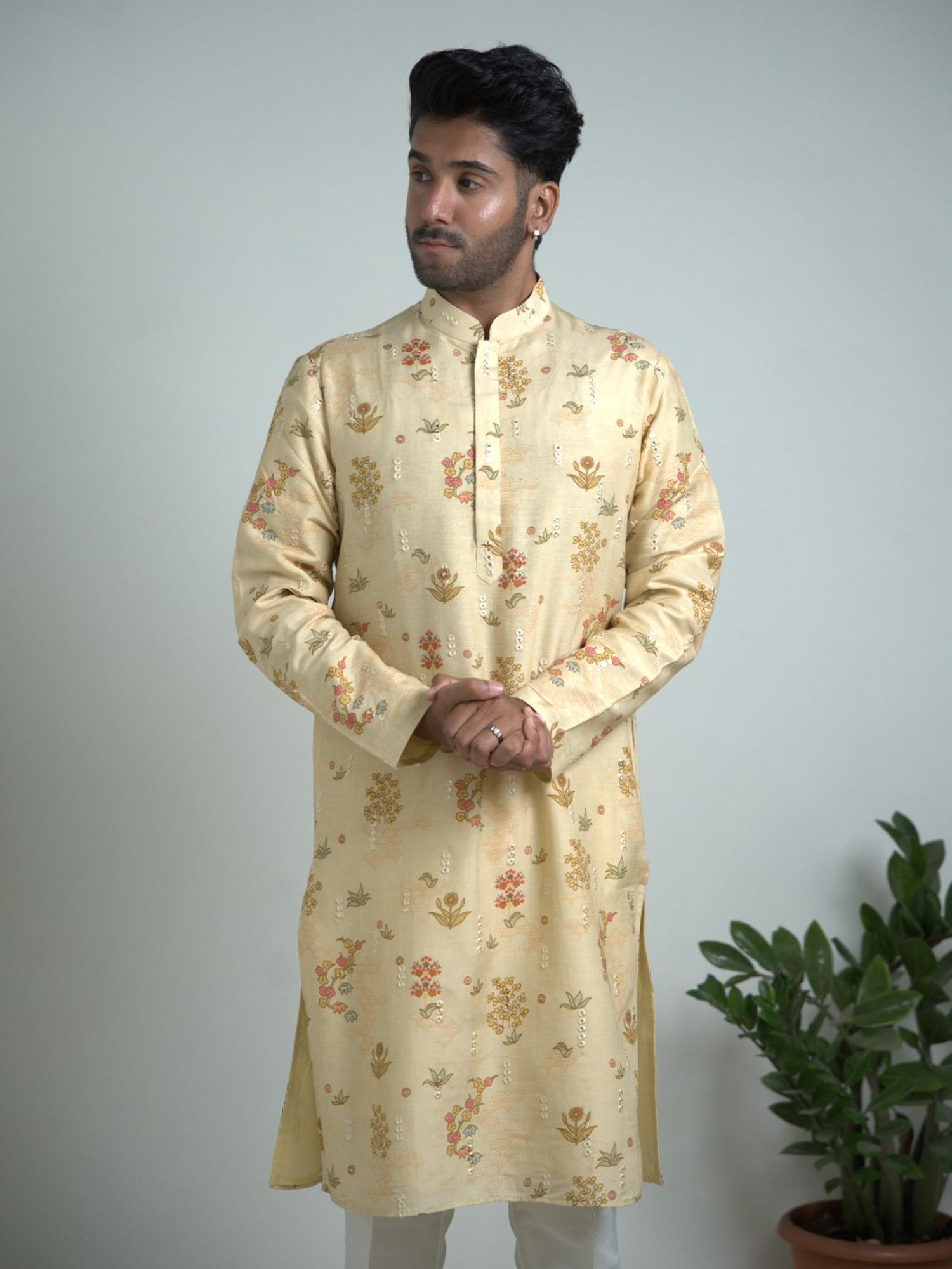 Cream Tusser silk with mirror work kurta trouser set.