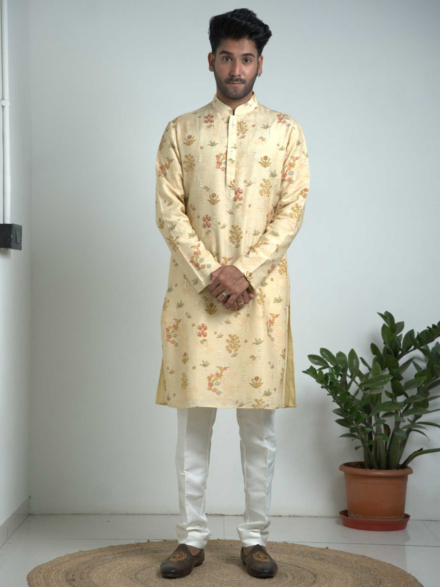 Cream Tusser silk with mirror work kurta trouser set.