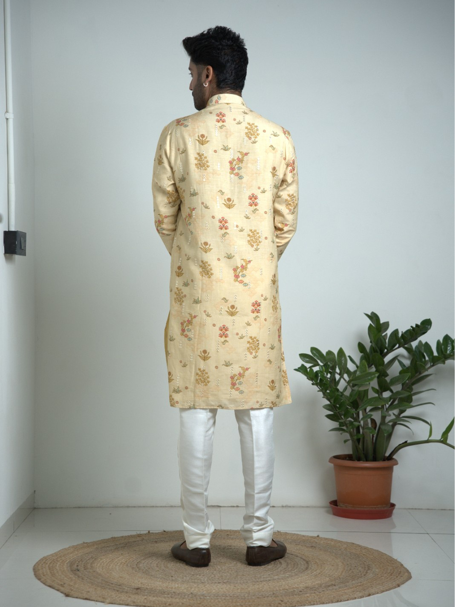 Cream Tusser silk with mirror work kurta trouser set.